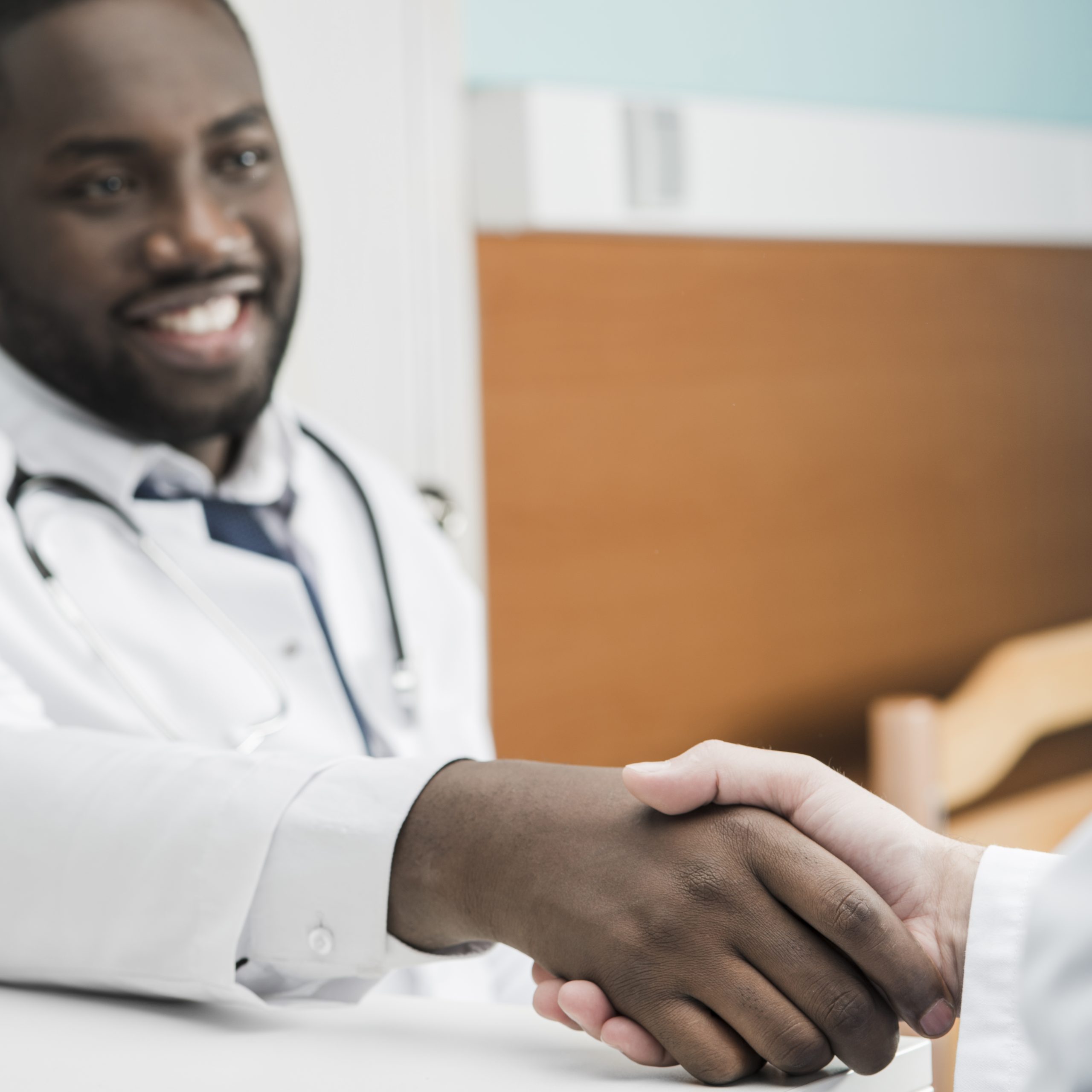 black-medic-shaking-hand